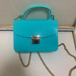 Turquoise purse with gold chain
